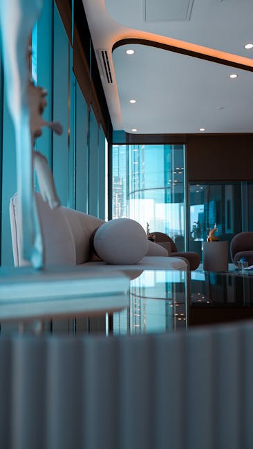 VIP lounge area with blue ambient lighting and comfortable seating